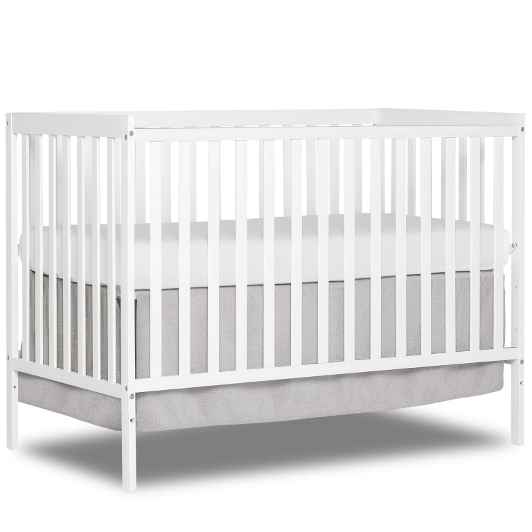 White-finished wooden crib with vertical slats, straight top rails and corner posts, pictured with a mattress against a white background