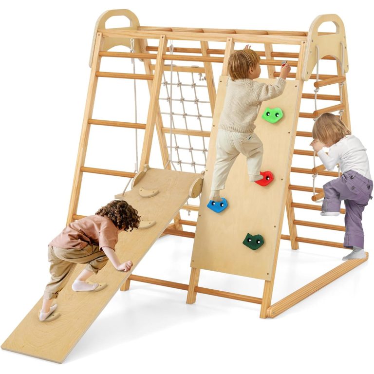 Wooden indoor jungle gym with ladder rungs, overhead bars, a rope net and a foothold ramp, pictured with children against a white background
