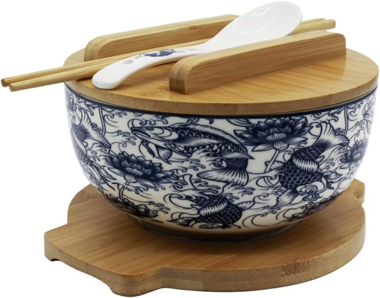 Blue-and-white ceramic ramen bowl with fish pattern, bamboo lid, trivet, chopsticks and ceramic spoon