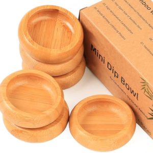 Six small round bamboo dipping bowls stacked beside a Mini Dip Bowl box