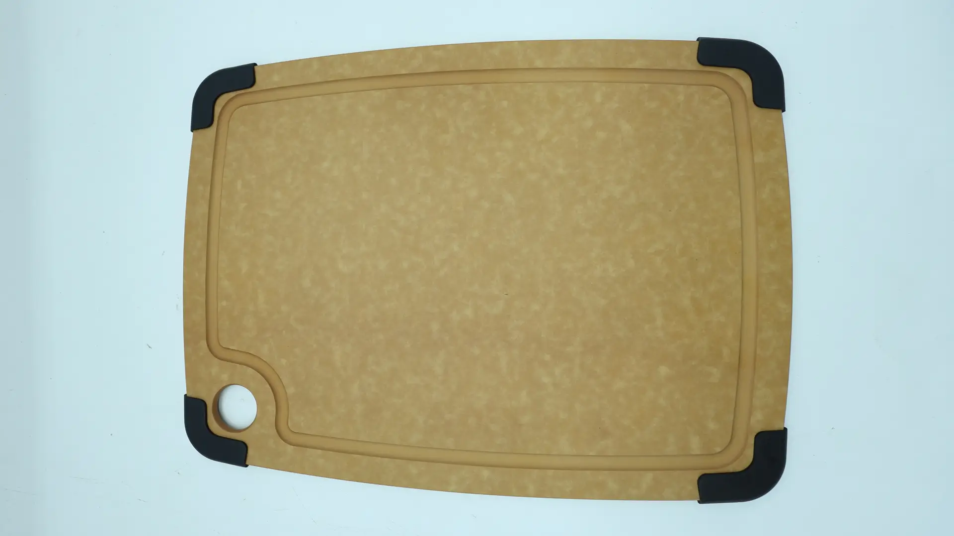 Cleaning a wood fiber cutting board with mild soap and a soft sponge