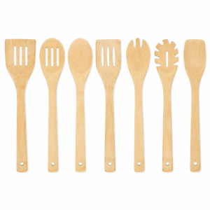 Seven-piece bamboo cooking utensil set arranged on a white background
