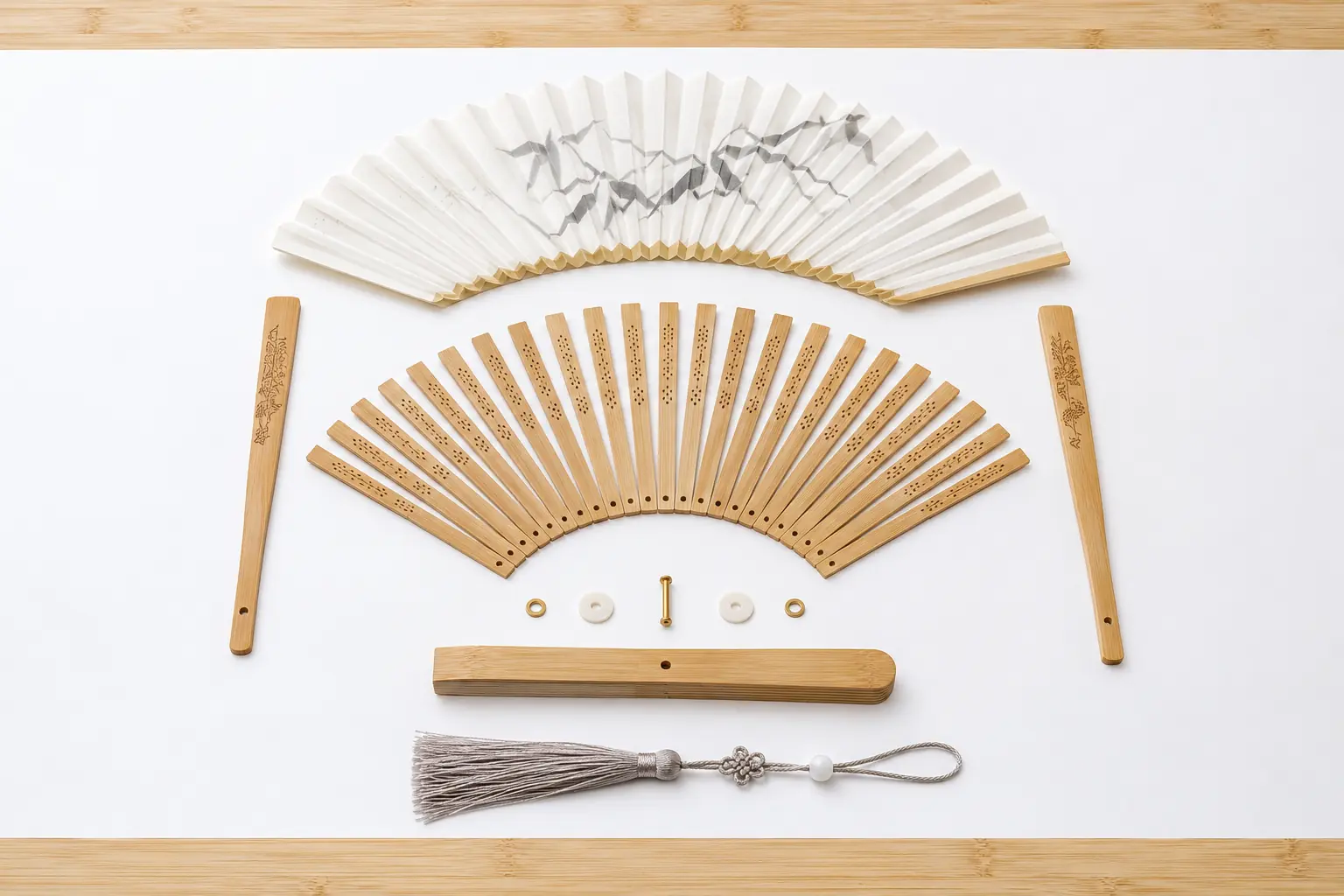 Bamboo folding fan components showing guard sticks inner ribs pivot and folded leaf