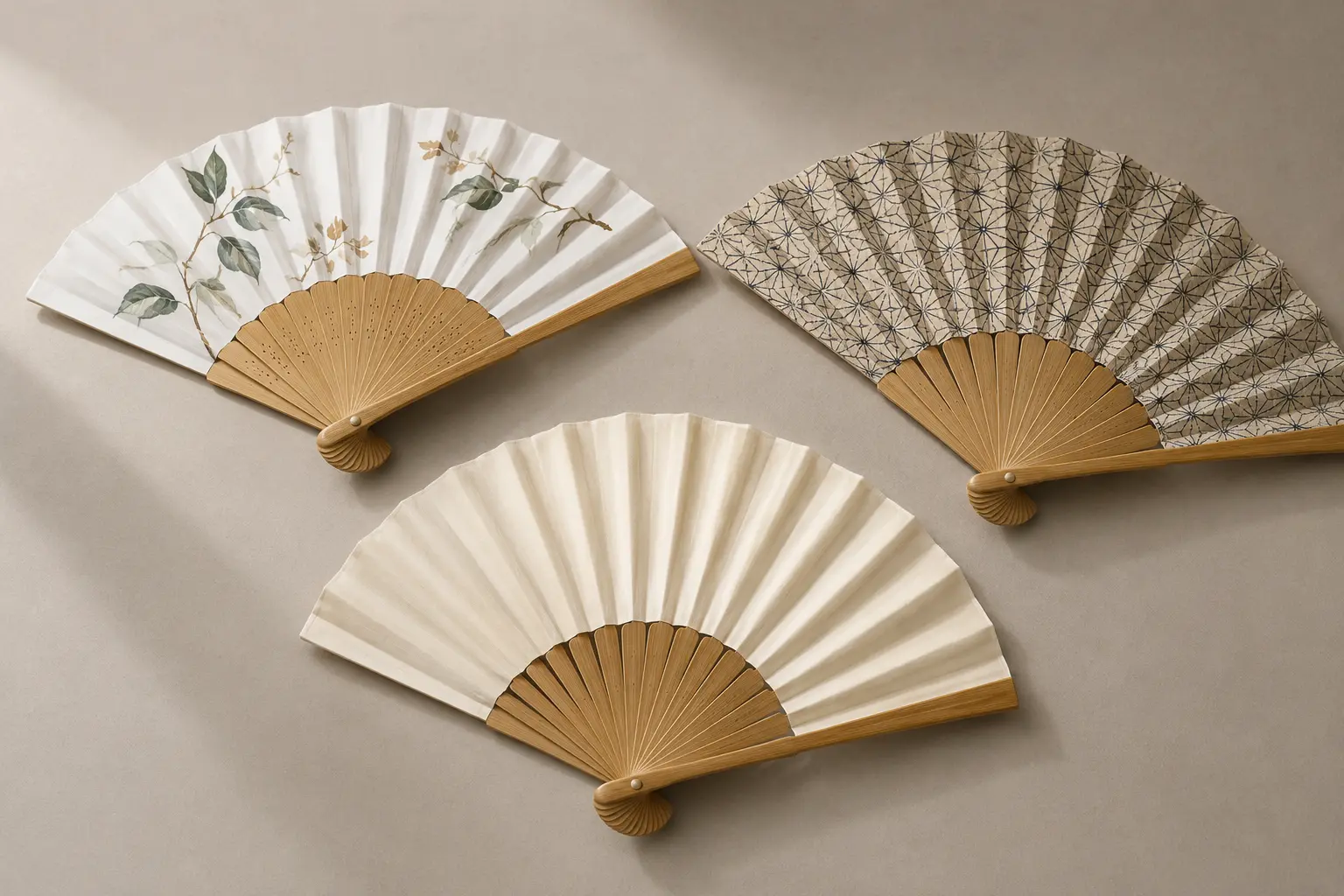 Three bamboo folding fans with painted paper, printed paper and plain silk decoration options