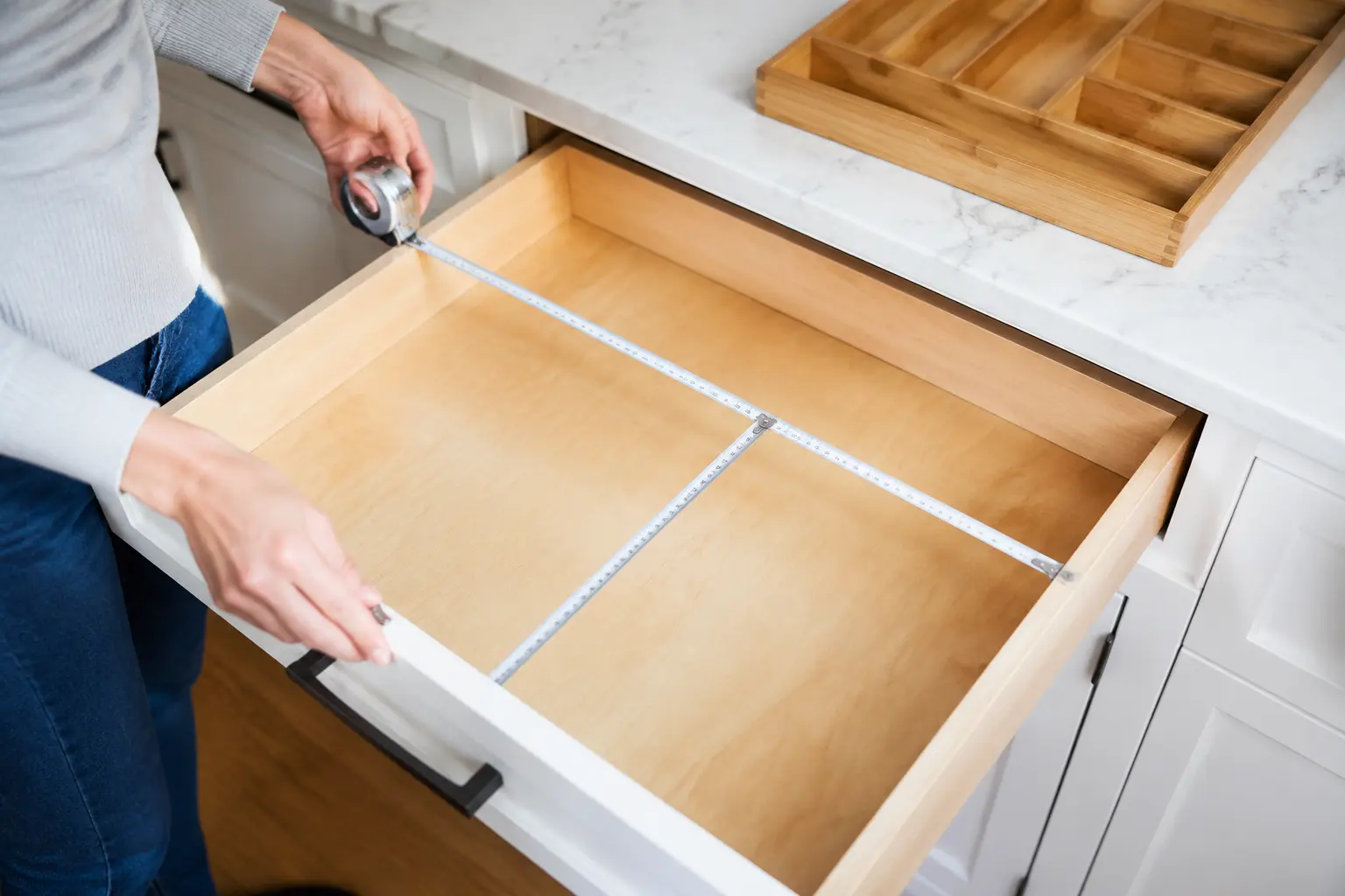 Measuring the width depth and height of a drawer for a bamboo cutlery tray