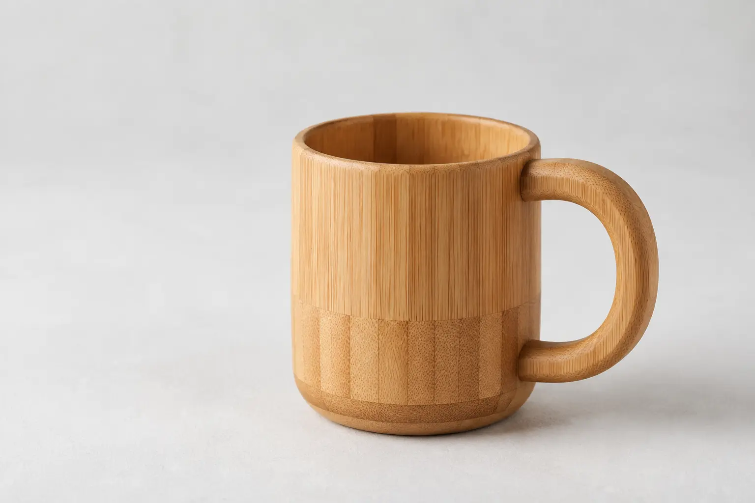 Laminated bamboo mug with a machined handle and regular grain